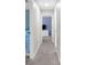 Hallway with views of bedrooms and neutral carpet flooring at 8084 Nightingale Rd, Weeki Wachee, FL 34613