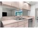 Open kitchen featuring modern appliances and bar seating at 8084 Nightingale Rd, Weeki Wachee, FL 34613