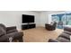 Comfortable living room with plush seating and sliding doors leading to the outdoors at 8084 Nightingale Rd, Weeki Wachee, FL 34613