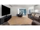 Spacious living room featuring neutral carpet and sliding glass doors at 8084 Nightingale Rd, Weeki Wachee, FL 34613