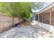 Wide shot of the backyard with screened patio and privacy fence at 8634 Roble Way, Port Richey, FL 34668