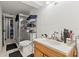 Bathroom featuring marble sink top, walk-in shower, and black floor mat at 8634 Roble Way, Port Richey, FL 34668