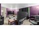Purple bedroom featuring dark curtains, bed, and view of office area at 8634 Roble Way, Port Richey, FL 34668