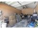 Garage space featuring extra storage potential with shelving and ample room for bikes at 8634 Roble Way, Port Richey, FL 34668