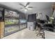 Unique office with custom reptile terrariums, a desk area, and tiled floors at 8634 Roble Way, Port Richey, FL 34668