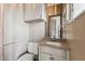 Bathroom featuring a white vanity and built-in storage at 8755 Marigold Dr, New Port Richey, FL 34654