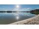 The sun glints off of the water and the sandy beach provides a natural experience at 8755 Marigold Dr, New Port Richey, FL 34654