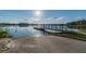 Boat ramp with a dock, offering convenient access to the lake for boating and fishing enthusiasts at 8755 Marigold Dr, New Port Richey, FL 34654