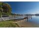 Community dock with boat access on tranquil waters, perfect for fishing and watersports at 8755 Marigold Dr, New Port Richey, FL 34654
