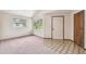 Inviting entryway featuring unique flooring design, neutral walls, and lots of natural light at 8755 Marigold Dr, New Port Richey, FL 34654