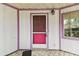 Close-up of the home's charming front door and covered porch area at 8755 Marigold Dr, New Port Richey, FL 34654