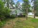 Single-story home with mature trees and landscaping at 8755 Marigold Dr, New Port Richey, FL 34654