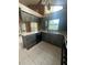 Bright kitchen features unique cabinetry, stainless sink, and ample counter space at 8755 Marigold Dr, New Port Richey, FL 34654