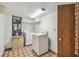 Utility room with washer, dryer, and additional storage space at 8755 Marigold Dr, New Port Richey, FL 34654