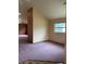 A basic living room featuring a single window and neutral-colored walls at 8755 Marigold Dr, New Port Richey, FL 34654