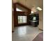 Open living space features tile flooring, high ceilings, and unique chandelier at 8755 Marigold Dr, New Port Richey, FL 34654