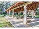 Community pavilion with picnic tables, offering a shaded area for outdoor gatherings and relaxation at 8755 Marigold Dr, New Port Richey, FL 34654