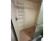 A shower with a built-in rack and pink tile at 8755 Marigold Dr, New Port Richey, FL 34654