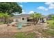 Large backyard pool with a water feature surrounded by rock at 8850 March Ct, New Port Richey, FL 34655