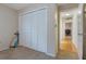 Bedroom featuring carpet flooring, closet, and a view to another room at 8850 March Ct, New Port Richey, FL 34655