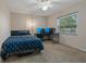 Bedroom with a window view featuring a bed, desk, and ceiling fan at 8850 March Ct, New Port Richey, FL 34655