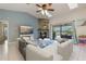 Bright living room featuring a stone fireplace, skylights, tile floors, and a sliding glass door at 8850 March Ct, New Port Richey, FL 34655