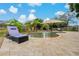 A lovely backyard pool setting with a water feature, lounge chairs and shade at 8850 March Ct, New Port Richey, FL 34655