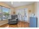 Sitting room with a gray recliner and hardwood flooring at 8850 March Ct, New Port Richey, FL 34655
