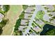 Overhead view showcasing the neighborhood layout near the golf course and a tranquil pond at 9200 Turnberry Ct, New Port Richey, FL 34655