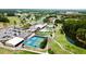 Aerial view of the clubhouse with golf course and ponds at 9200 Turnberry Ct, New Port Richey, FL 34655