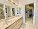 Large primary bathroom featuring double sinks and large vanity area with lots of storage at 9200 Turnberry Ct, New Port Richey, FL 34655
