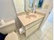 Well-maintained bathroom featuring a single sink vanity and tiled floors for easy maintenance at 9200 Turnberry Ct, New Port Richey, FL 34655
