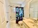 Clean and functional bathroom with a shower-tub combination and a single sink vanity at 9200 Turnberry Ct, New Port Richey, FL 34655