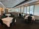 Spacious event space with tables and chairs, perfect for hosting gatherings and celebrations at 9200 Turnberry Ct, New Port Richey, FL 34655