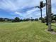 Expansive golf course with lush green fairways and water features, perfect for a day of golfing at 9200 Turnberry Ct, New Port Richey, FL 34655