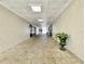 Hallway with doors and decorative potted plant at 9200 Turnberry Ct, New Port Richey, FL 34655