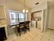 Laundry area adjacent to dining space, complete with essential appliances and extra storage at 9200 Turnberry Ct, New Port Richey, FL 34655