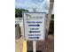 Seven Springs Golf & Country Club Sign pointing to practice range, bar, and tennis courts at 9200 Turnberry Ct, New Port Richey, FL 34655