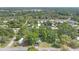 Community aerial view with tree coverage and neighborhood streets on a sunny day at 9401 Bourbon St, New Port Richey, FL 34654