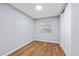 Bedroom featuring laminate floors, neutral paint and window with blinds at 9401 Bourbon St, New Port Richey, FL 34654