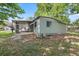 Exterior of home featuring a screened-in porch, great for enjoying the outdoors at 9401 Bourbon St, New Port Richey, FL 34654