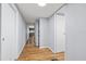 Hallway featuring wood-look floors and light-colored walls at 9401 Bourbon St, New Port Richey, FL 34654