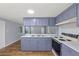 Updated kitchen with sleek countertops, and white backsplash paired with modern appliances at 9401 Bourbon St, New Port Richey, FL 34654