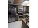 Kitchen featuring stainless steel appliances and ample cabinet space, perfect for cooking and entertaining at 9516 Glen Moor Ln, Port Richey, FL 34668