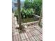 Outdoor pond with brick border and lush greenery adding a tranquil element to the backyard at 9516 Glen Moor Ln, Port Richey, FL 34668