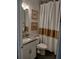 Well-maintained bathroom with granite countertop, modern fixtures, and stylish decor at 9967 Patrician Dr, New Port Richey, FL 34655