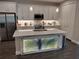 Modern kitchen with stainless steel appliances, a stylish island, and ample cabinet space at 9967 Patrician Dr, New Port Richey, FL 34655
