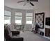 Comfortable living room with ample natural light, neutral color scheme, and cozy seating area at 9967 Patrician Dr, New Port Richey, FL 34655