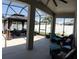 Spacious screened-in patio with ample seating and gazebo, perfect for outdoor entertaining and relaxation at 9967 Patrician Dr, New Port Richey, FL 34655