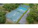 Aerial view of the community tennis courts and playground at 10044 Twelve Oaks Ct, Weeki Wachee, FL 34613